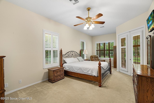 bedroom with light carpet, a ceiling fan, visible vents, and access to exterior