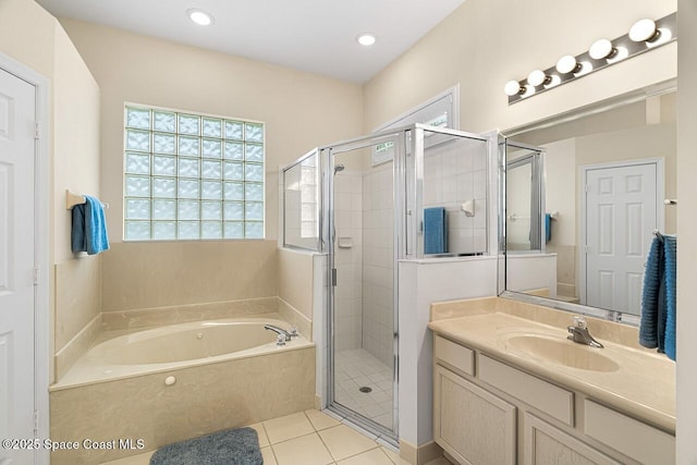 full bathroom featuring tile patterned flooring, recessed lighting, vanity, a bath, and a stall shower