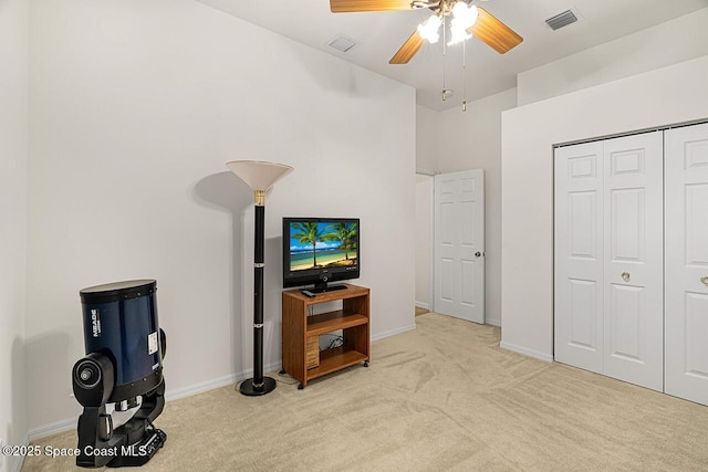 interior space featuring visible vents, light carpet, and baseboards