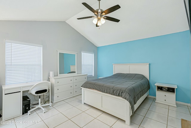 bedroom with light tile patterned floors, baseboards, vaulted ceiling, and a ceiling fan