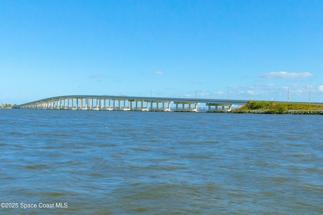 property view of water with a pier