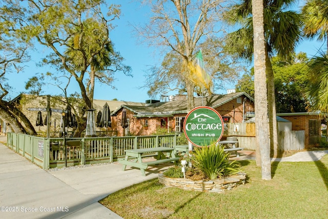 exterior space with a yard and fence