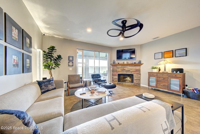 living room with recessed lighting, visible vents, ceiling fan, and a stone fireplace