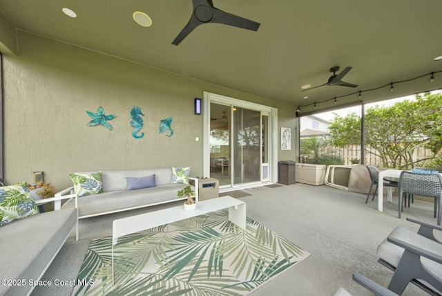 view of patio / terrace with a ceiling fan, fence, and an outdoor hangout area