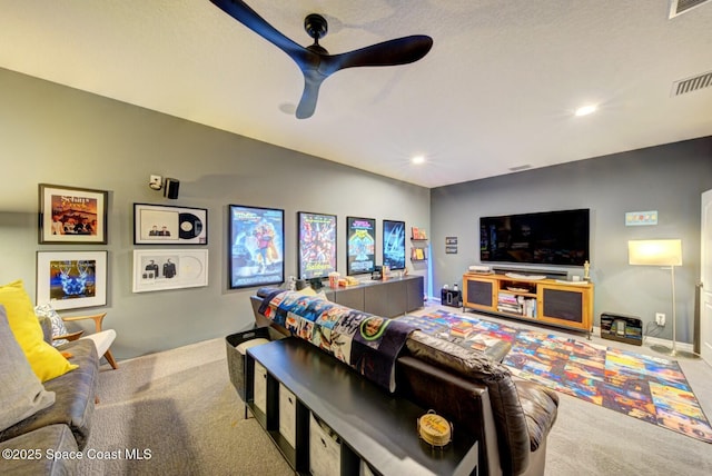 carpeted living room featuring visible vents, a ceiling fan, and recessed lighting