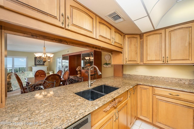 kitchen featuring light tile patterned floors, visible vents, light stone counters, a chandelier, and a sink