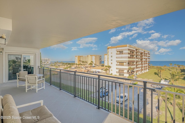 balcony featuring a water view