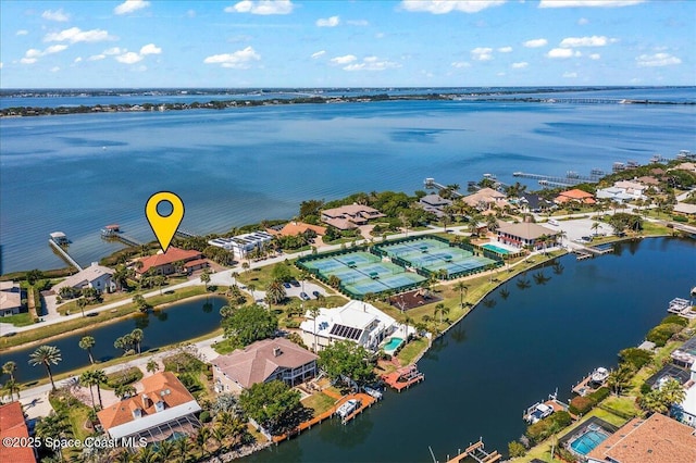 birds eye view of property featuring a residential view and a water view