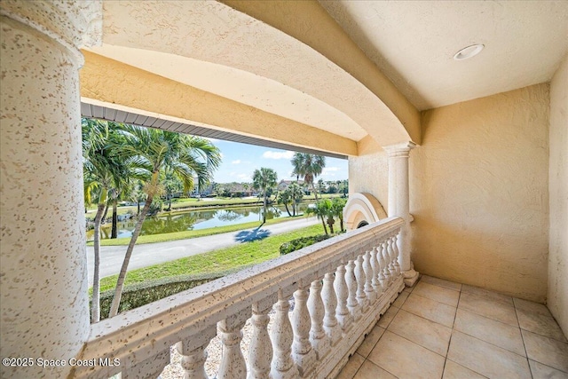 balcony featuring a water view