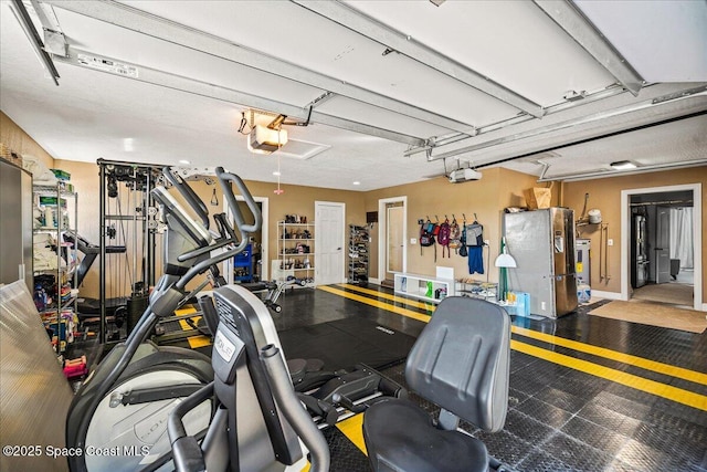 gym featuring a garage and baseboards