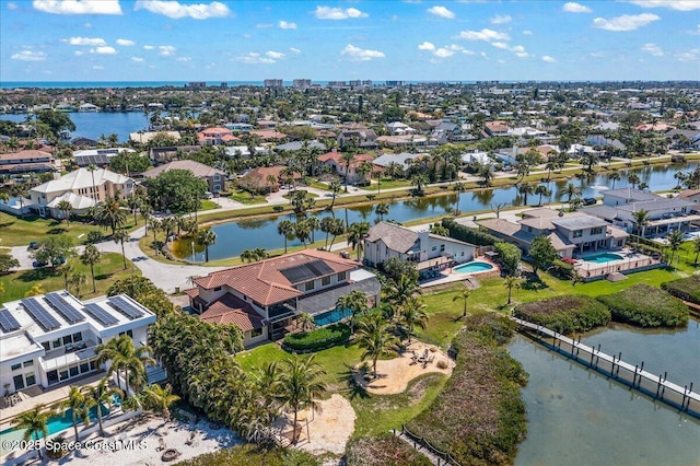 aerial view with a residential view and a water view