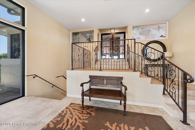 staircase featuring recessed lighting and baseboards