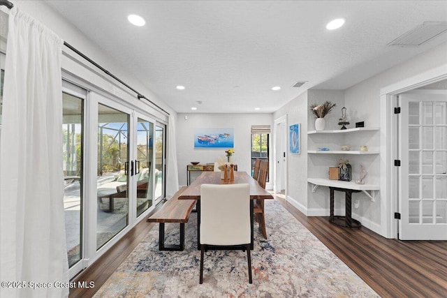 dining room featuring visible vents, wood finished floors, and recessed lighting