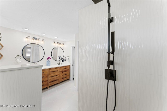 full bathroom with tile patterned flooring and vanity