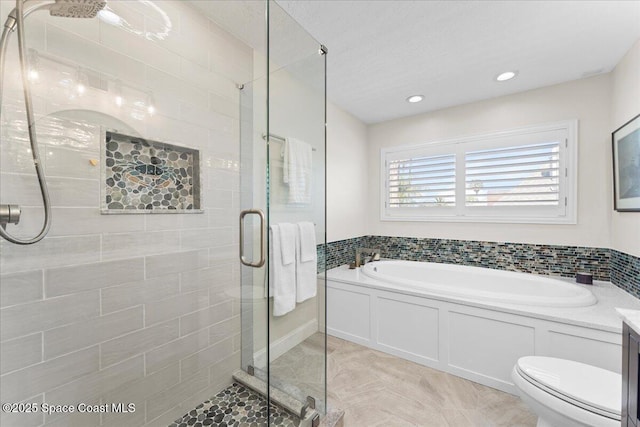 full bathroom with a garden tub, recessed lighting, toilet, a shower stall, and tile patterned flooring