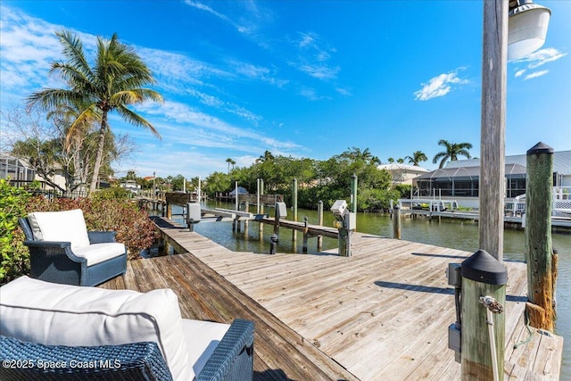 view of dock featuring a water view and boat lift