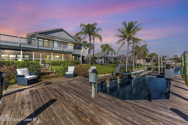 dock area featuring a water view and boat lift