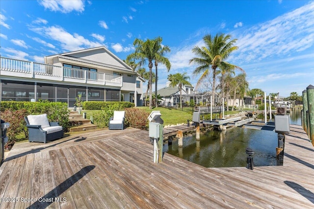 view of dock with a water view and boat lift