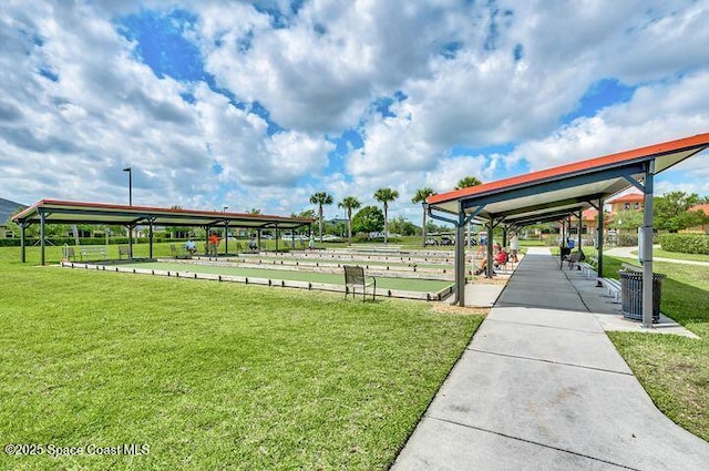 view of property's community with a yard