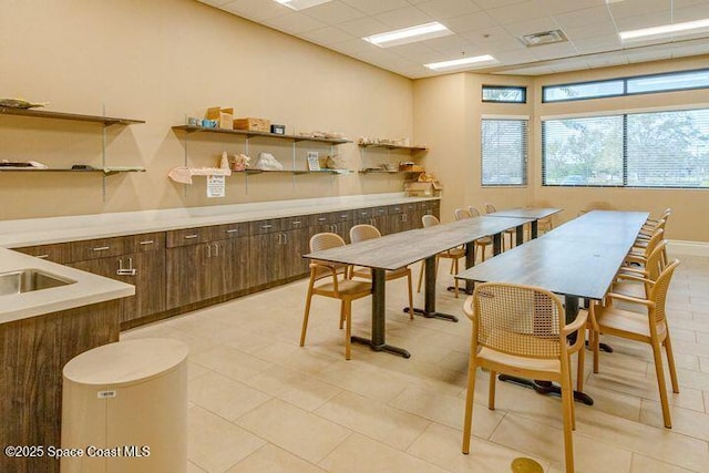 dining area with visible vents and a paneled ceiling