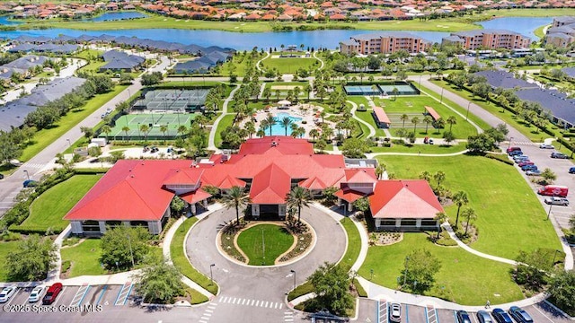 bird's eye view with a residential view and a water view