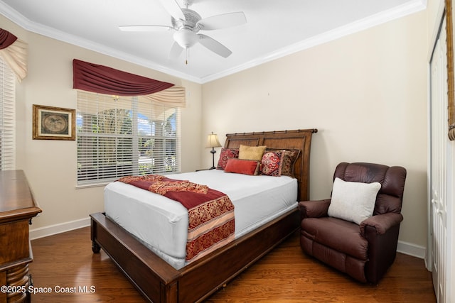 bedroom with ceiling fan, ornamental molding, wood finished floors, and baseboards