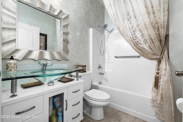 full bath featuring  shower combination, vanity, toilet, and tile patterned floors