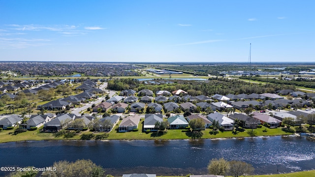 birds eye view of property featuring a residential view and a water view