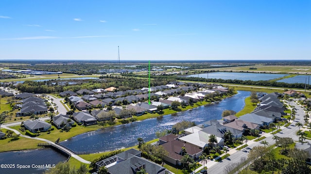 aerial view with a residential view and a water view