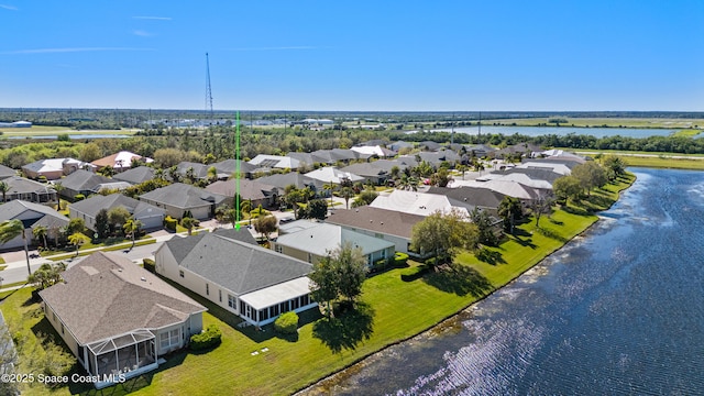 aerial view featuring a residential view and a water view