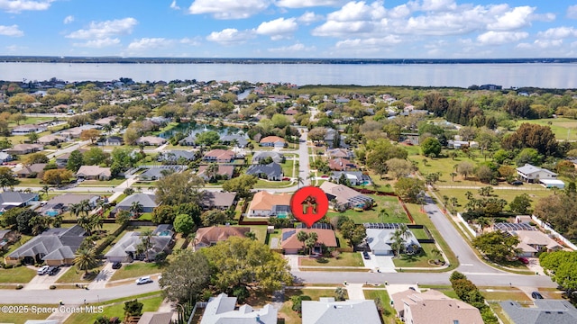 birds eye view of property with a residential view and a water view