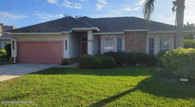 single story home with driveway, brick siding, a front lawn, and an attached garage