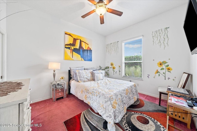 530 Carmel Dr, Melbourne, FL 32940 - bedroom with baseboards, a ceiling fan, and carpet floors