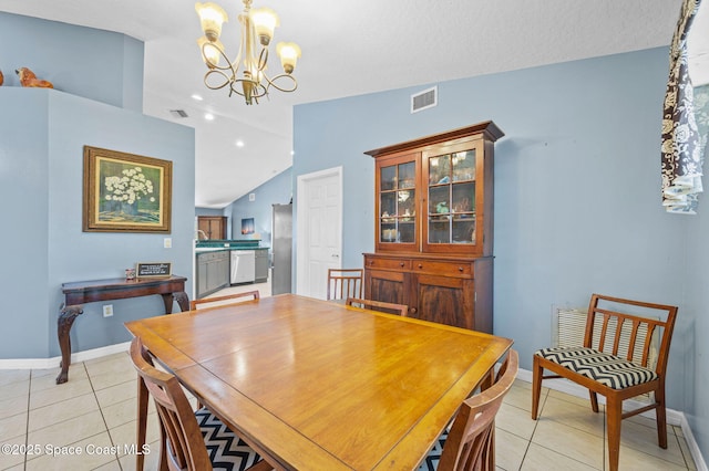 dining room featuring visible vents, baseboards, a chandelier, lofted ceiling, and light tile patterned floors