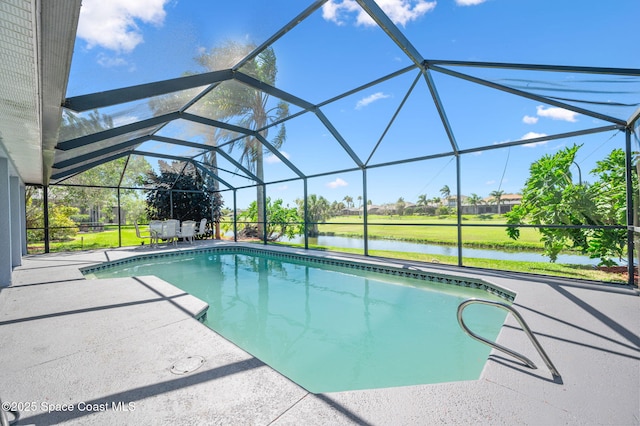 pool with a water view, a patio, and a lanai