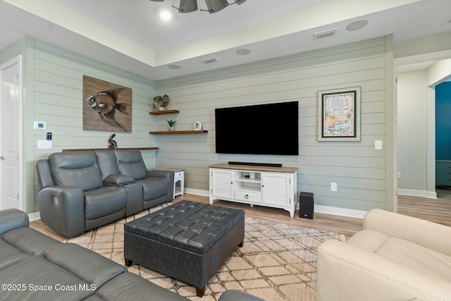 living room with light wood-type flooring, baseboards, visible vents, and recessed lighting