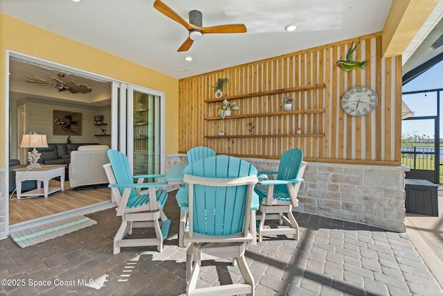 view of patio with a lanai and ceiling fan