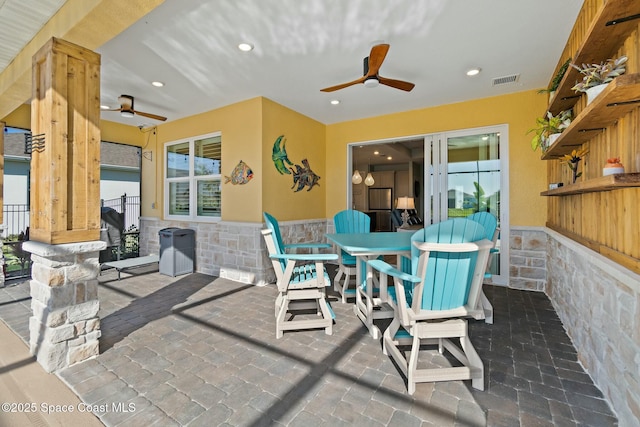 view of patio featuring visible vents and ceiling fan