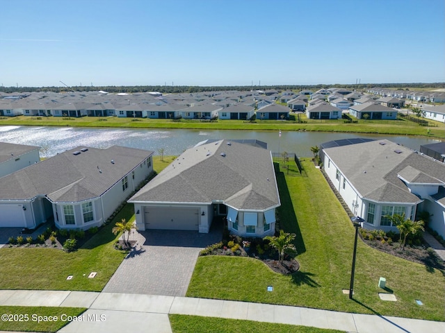 birds eye view of property with a residential view and a water view