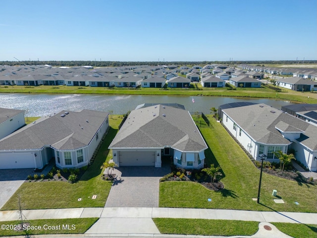 bird's eye view featuring a residential view and a water view