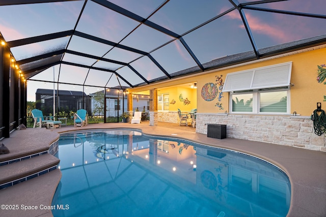 8850 Shoreline Ave, Melbourne, FL 32940 - outdoor pool featuring a patio and a lanai