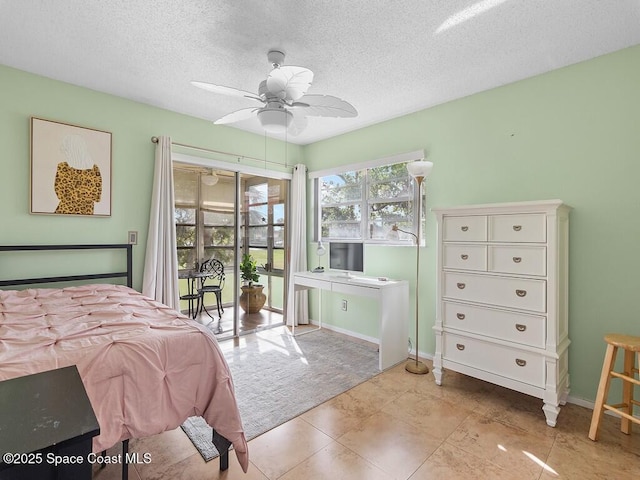 bedroom featuring a ceiling fan, carpet flooring, a textured ceiling, access to outside, and baseboards