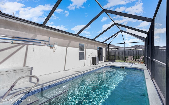 view of swimming pool with a fenced in pool, central AC unit, a patio area, glass enclosure, and fence