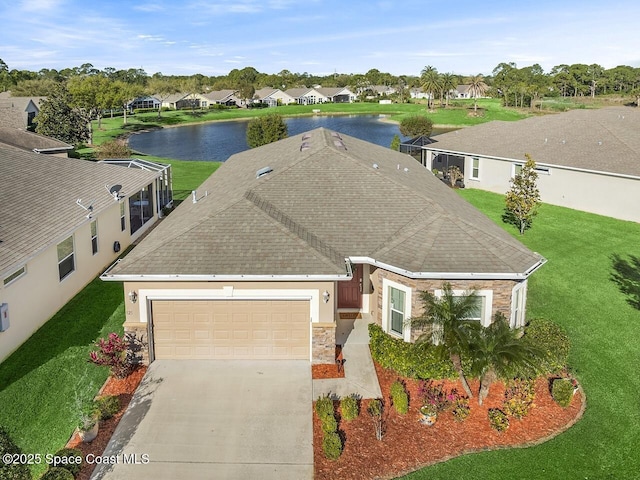 birds eye view of property with a residential view and a water view