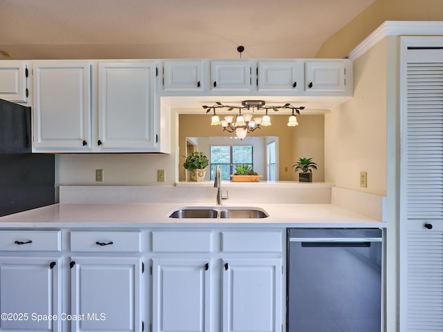 kitchen with a sink, white cabinetry, light countertops, and stainless steel dishwasher