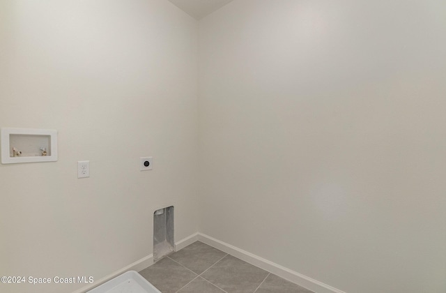 laundry room featuring light tile patterned flooring, hookup for a washing machine, hookup for an electric dryer, laundry area, and baseboards