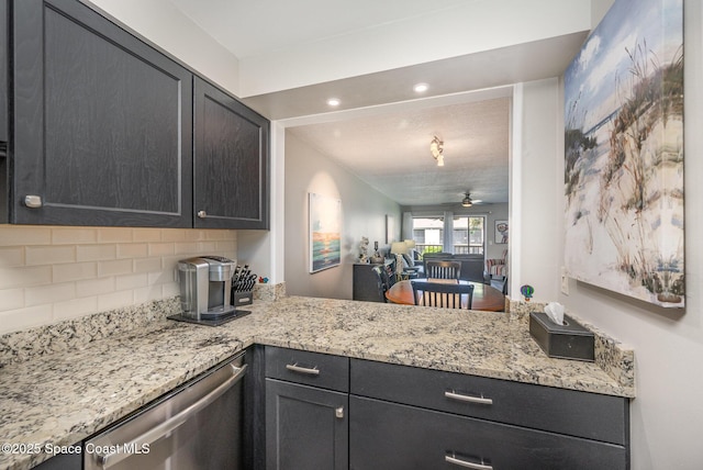 kitchen with tasteful backsplash, light stone counters, ceiling fan, and dishwasher