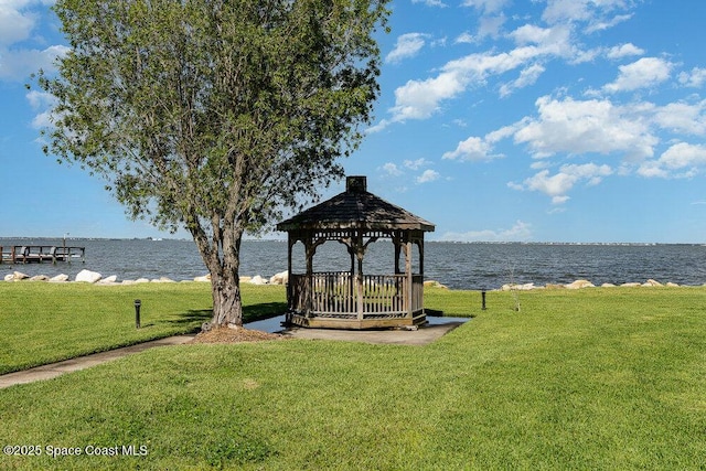 exterior space with a water view and a gazebo