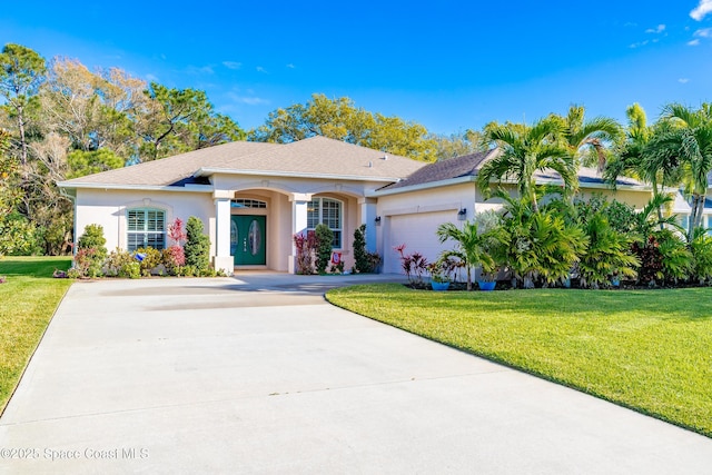 view of front of house featuring a garage, concrete driveway, a front yard, and stucco siding