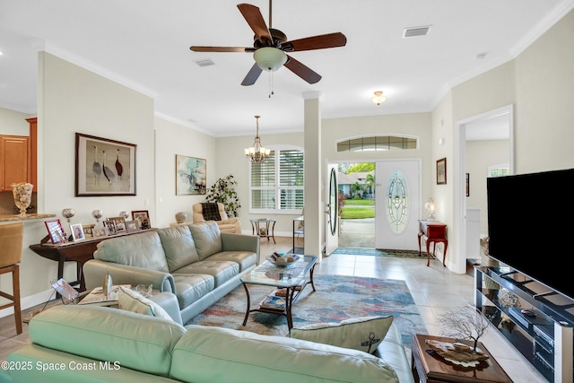 living room with light tile patterned floors, ceiling fan with notable chandelier, visible vents, and crown molding